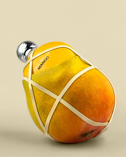 Max Philip Mango Eau de Parfum in an artistic scene reflecting boldness and exotic allure